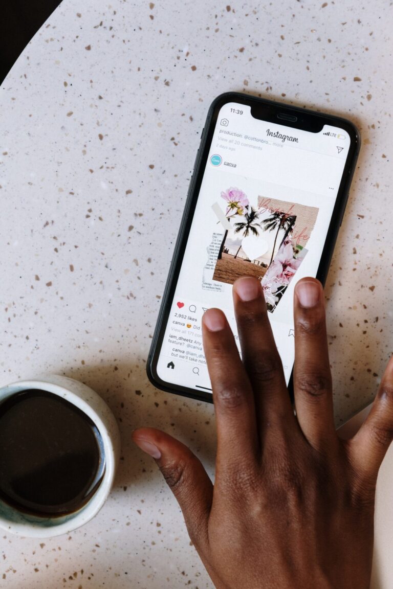 hand touching phone on table